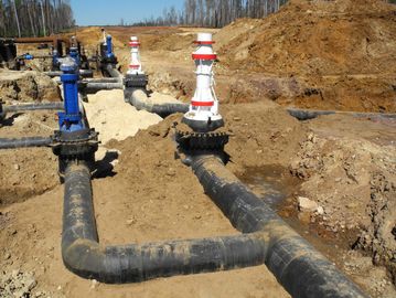 Large pipeline valves in a construction site.