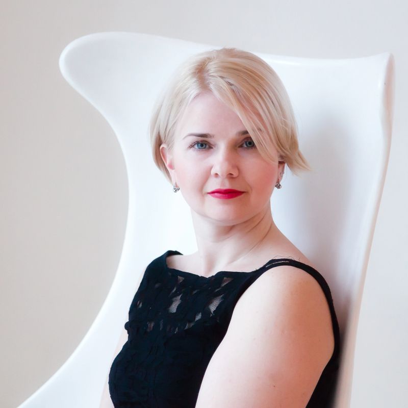 A woman is sitting in the room