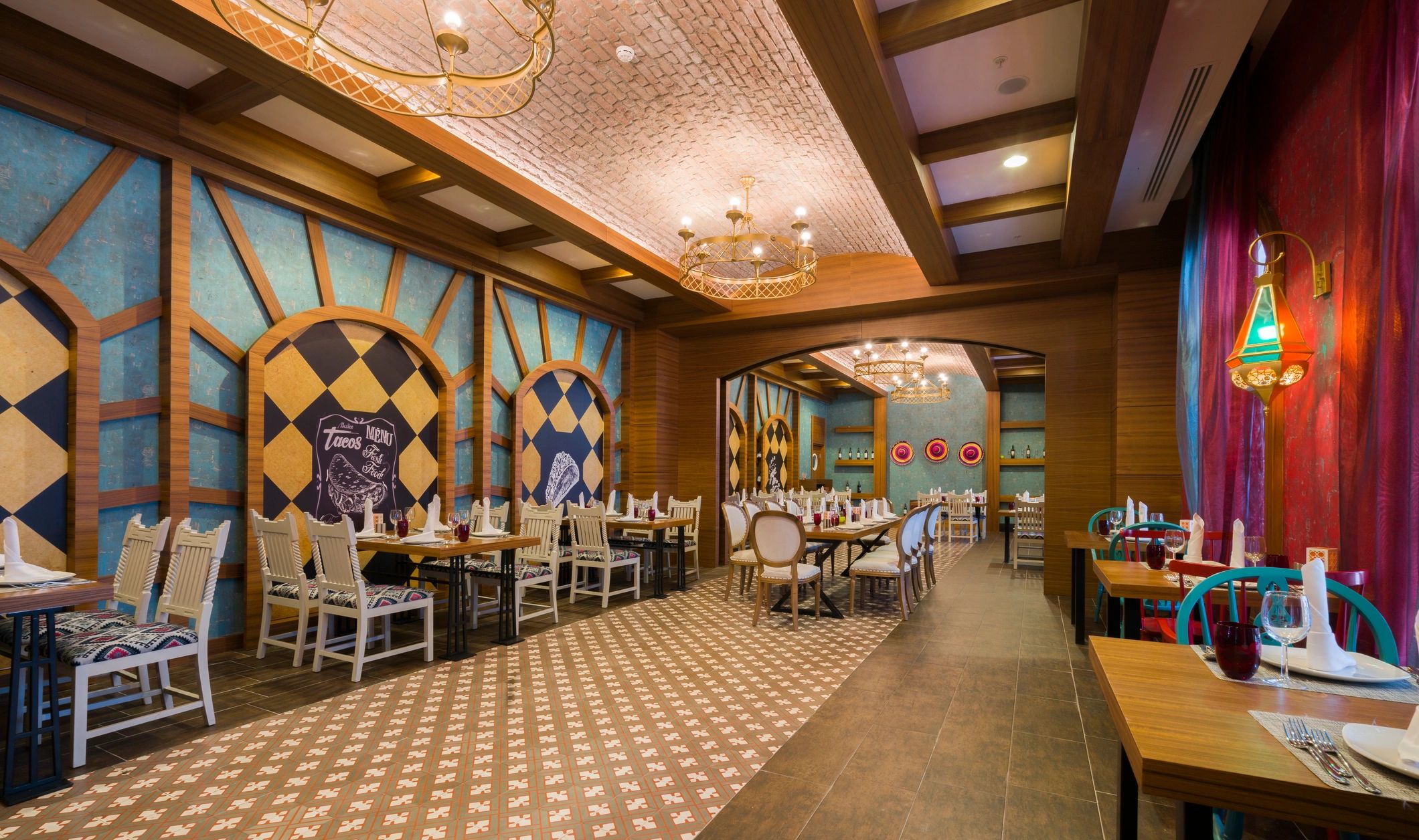 Cozy restaurant interior with colorful decor and wooden accents.