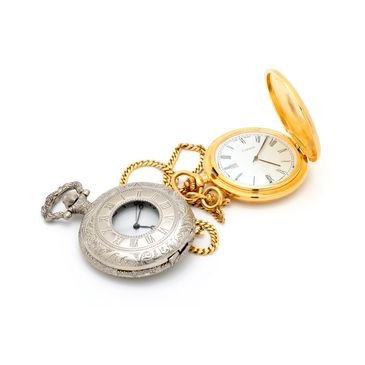 Two vintage pocket watches, one silver and one gold, displayed on white background.