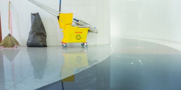 Cleaning equipment in a hallway corner.