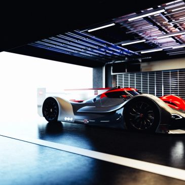 Sleek futuristic race car in a dim garage.