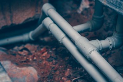Gray pipes installed underground.