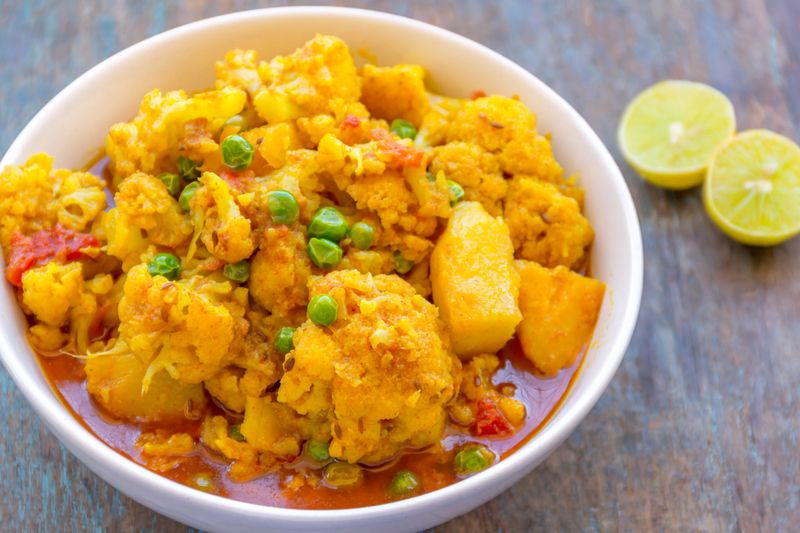 Cauliflower curry with potatoes - popular Indian vegetable curry.
