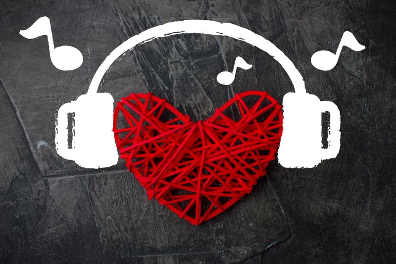 Heart in headphones on a dark background. Theme for Valentine's Day. Wedding, love 1