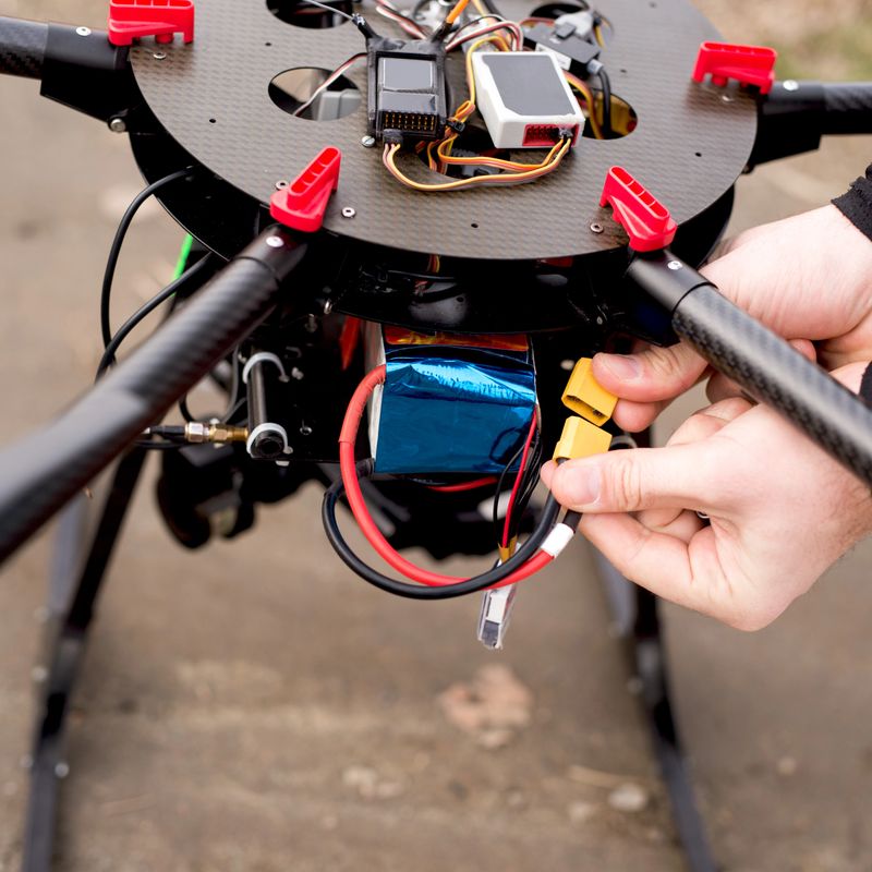 Battery plug drone before taking of. Aerial concept.