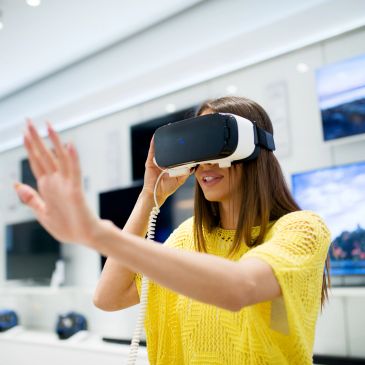 Woman enjoying a virtual reality experience with a VR headset.