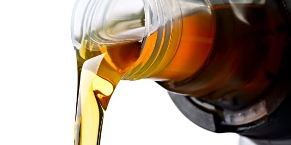 Golden liquid pouring from a bottle.