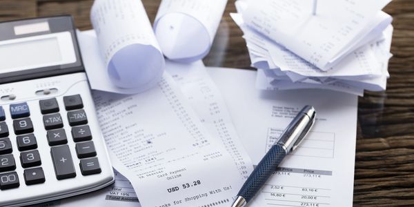 In the finance department calculator pain and papers on the table