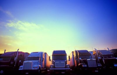 Fleet of class A commercial vehicles parked in a row