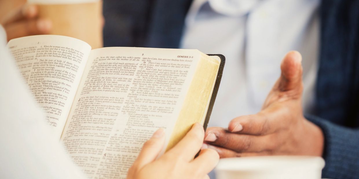 Two people discussing a passage from the Bible, focusing on Genesis 3-5.