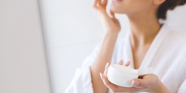 Skin care routine. applying moisturizer to dry skin. Visual for Ambivalent skincare 