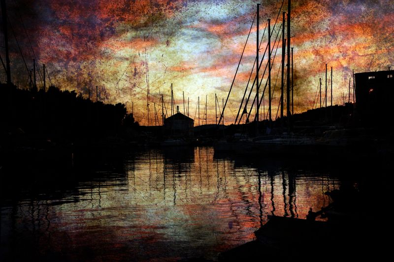 Marina on sunset grunge background
