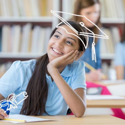 Smiling student daydreaming in class with graduation doodles.