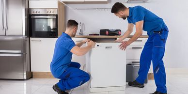 Technicians installing a dishwasher in Winnipeg. Trusted appliance installation with expert care