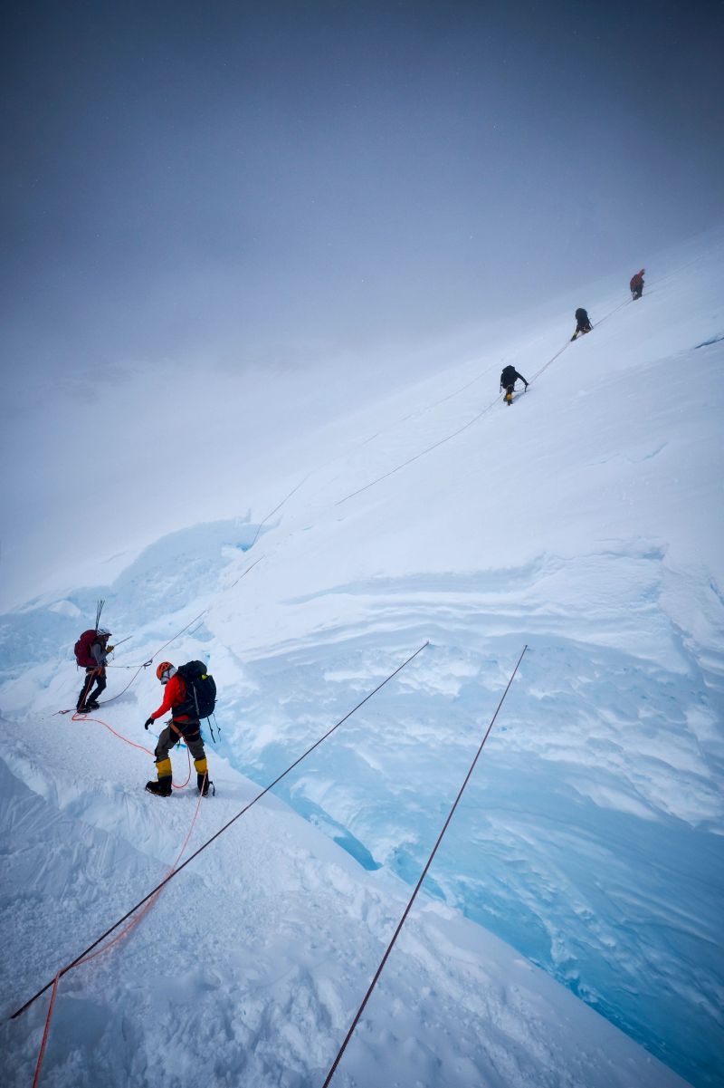 Mountaineers climb the headwall along the fixed ropes on Denali