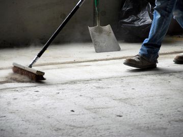 Sweeping and cleaning jobsite and drywall debris 