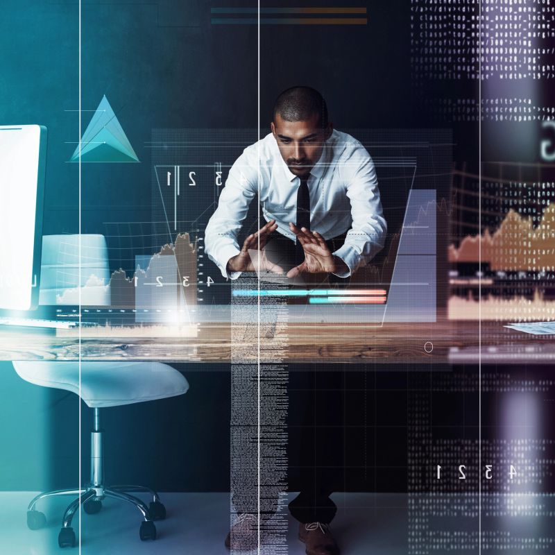 Shot of a handsome young businessman using a digital interface