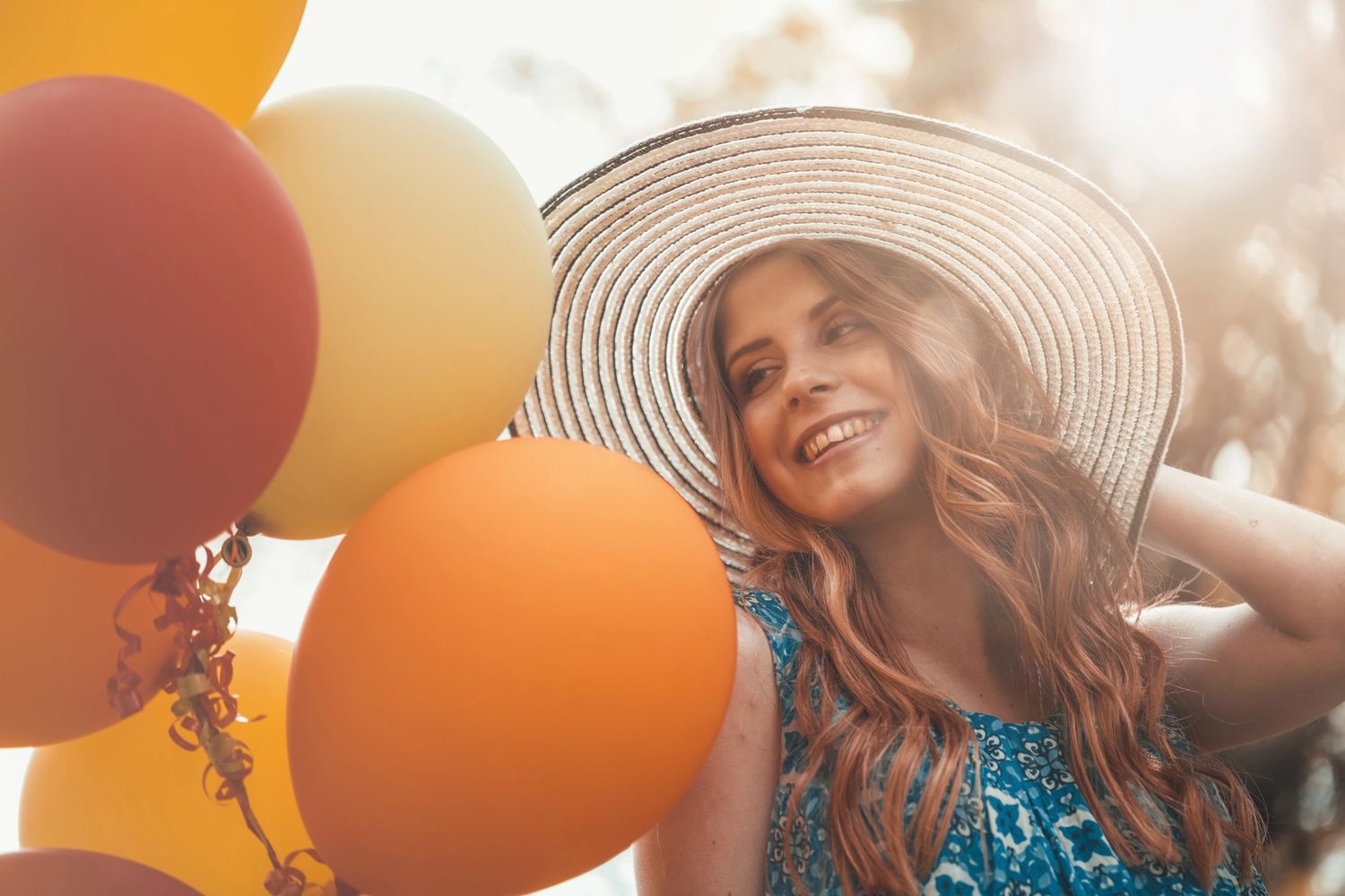 a woman happiness baloons happy event joy smile 