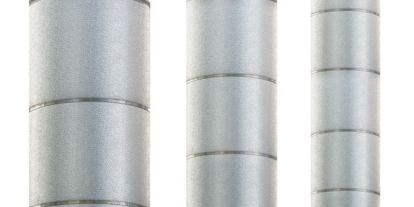 Three vertical silver metal pipes with visible seams and texture.
