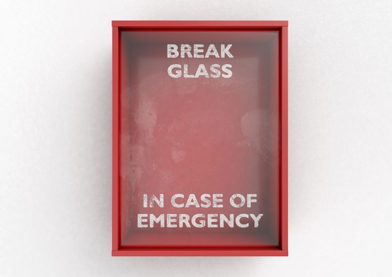 An empty red emergency box with an in case of emergency breakable glass on the front on an isolated background - 3D render