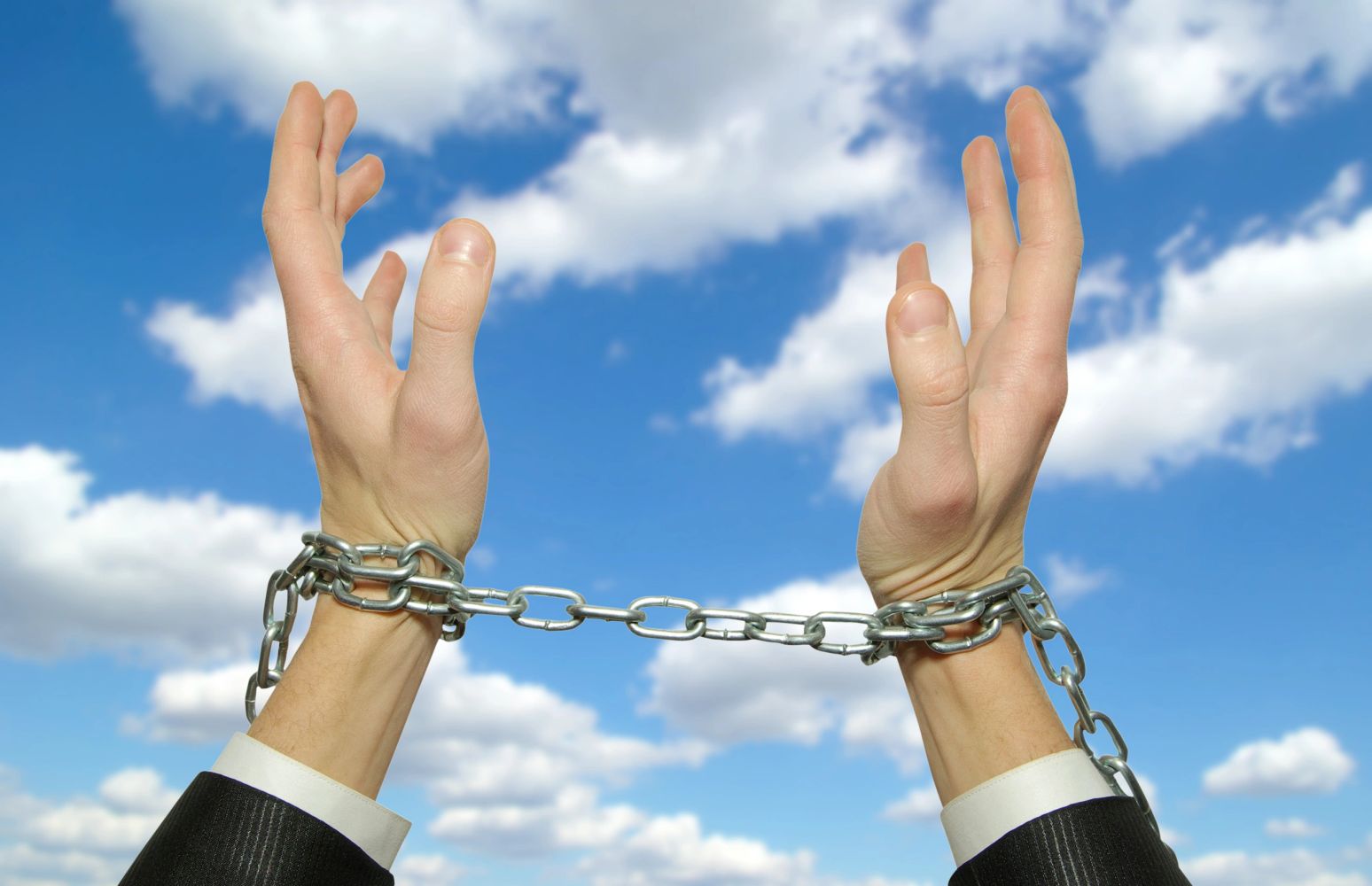Constraining Sapience symbolized by handcuffed in the sky with clouds.