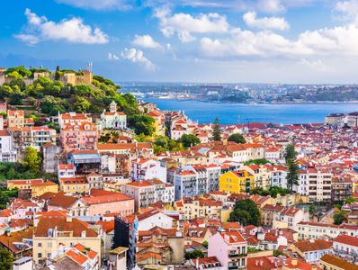 Photograph of one of the hills in Lisbon with the ocean in background
