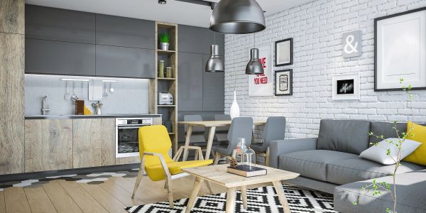 Modern living room with yellow accent chair and gray sofa.