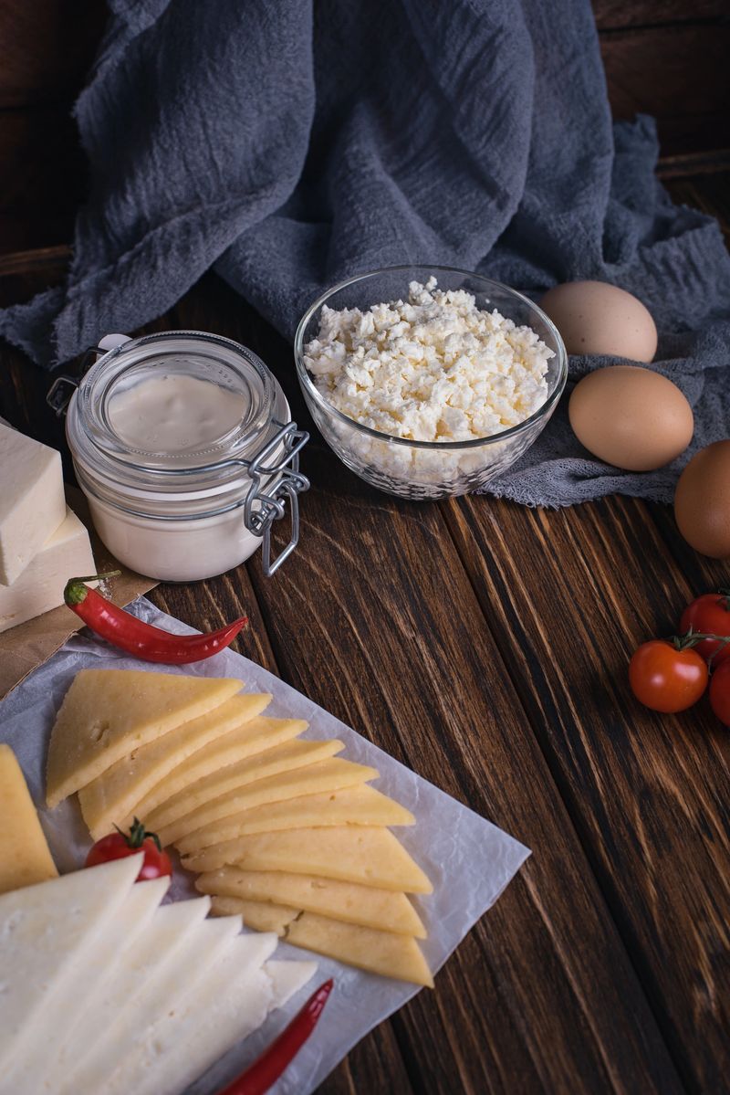 Farmers food products: milk, cream, cheese, eggs, cottage butter Rustic composition Organic food concept