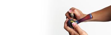 Various colorful glass smoking pipes displayed on a white surface.