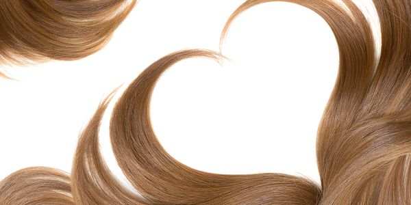Hair strands forming a heart shape.