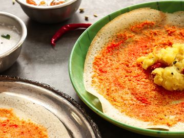 South Indian masala dosa served with chutney and sambar.