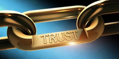 Chain links with the word 'TRUST' engraved.