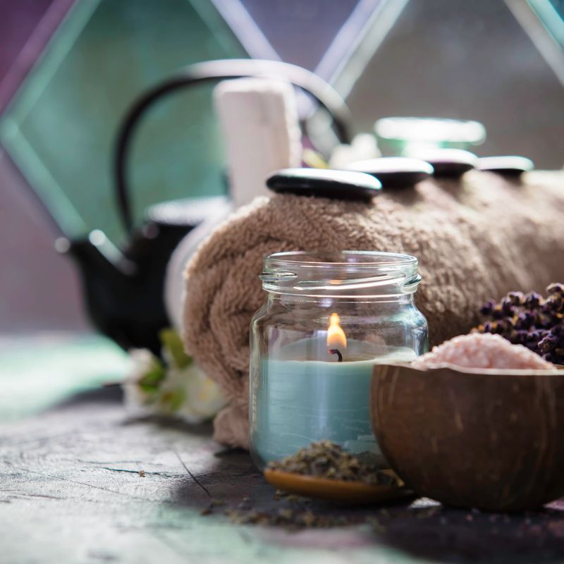 Asian tea set and spa settings on stone background near the old window. Natural spa treatment and relaxation concept