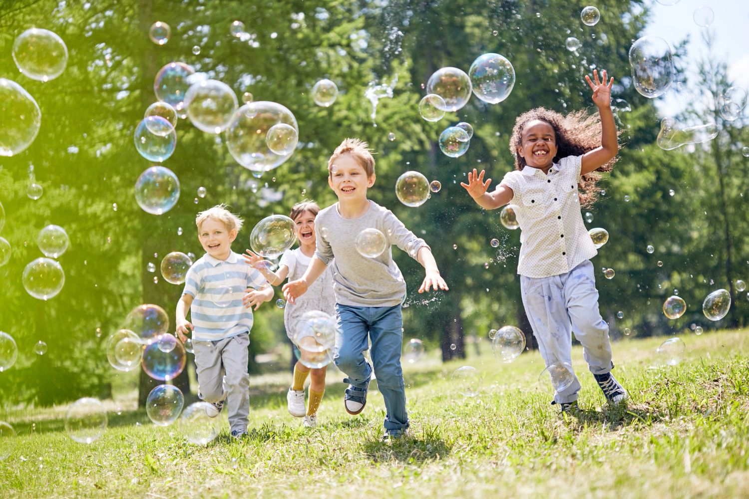 Image of children playing with bubbles outside