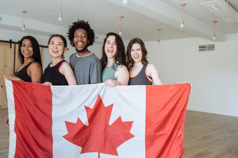 A group of young adults representing canada in a competion.