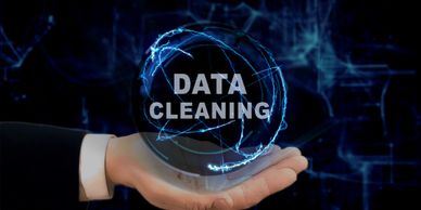 Hand holding a glowing orb with 'DATA CLEANING' text inside.