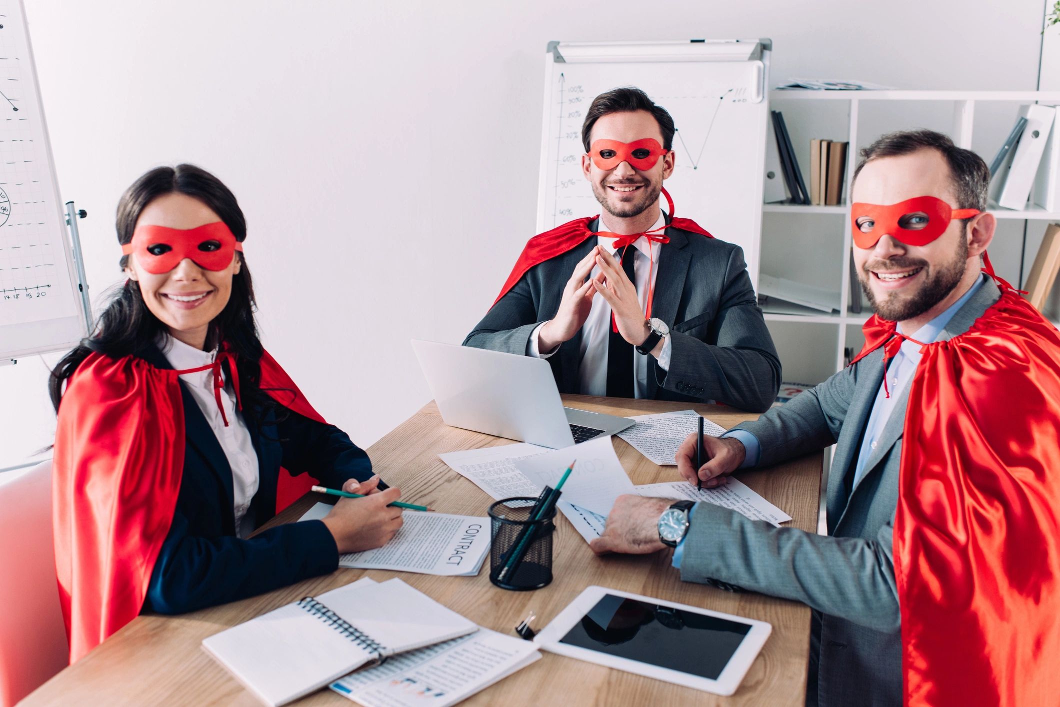 Three businesspeople dressed as superheroes in red capes and masks at a meeting.
hospitality operations
project-based consulting
staffing and recruiting
fractional management