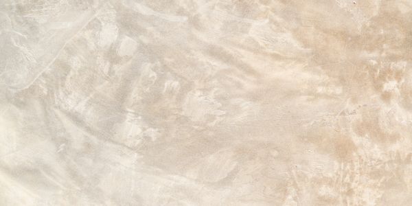 Beige textured wall with subtle plaster patterns.