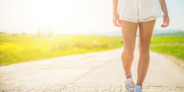 Woman walking outdoors, lipedema coaching and support