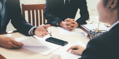 Homeowners consulting a construction lawyer