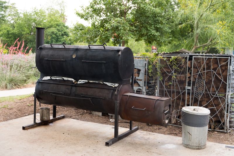 Southerny style smoker bbq in Texas where the cook is smoking some meat for a big dinner celebration.
