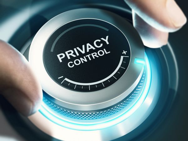 Hand adjusting a glowing dial labeled 'Privacy Control.'