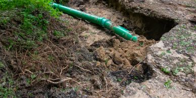 Exposed underground utility pipe following service locating and potholing for safe verification before excavation.