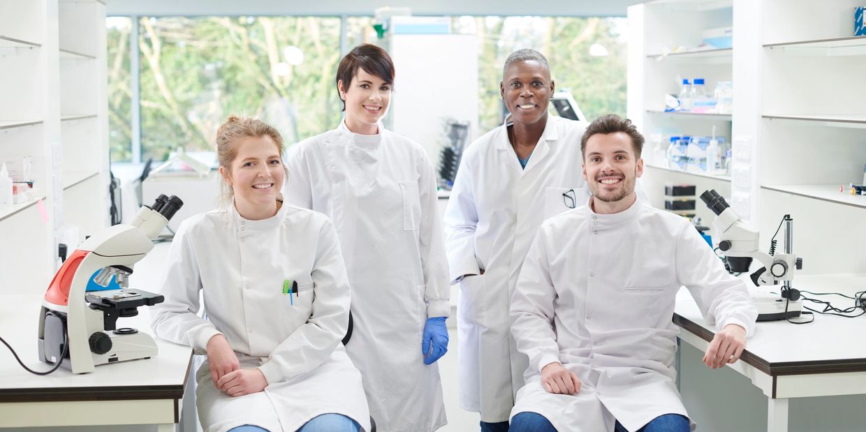 Lab technician with genomic tools.