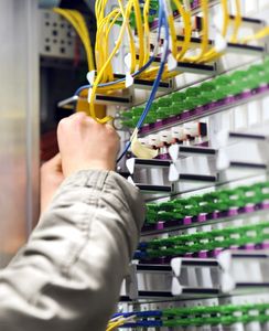 A vibrant, high-tech data center with illuminated server racks.