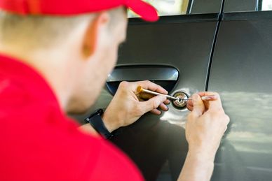Pic of man picking car lock.