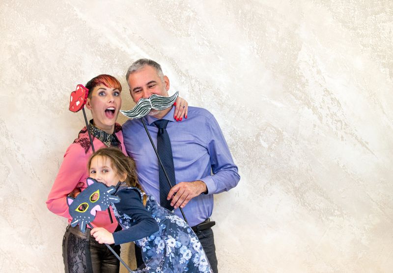 Playful Family in Photo Booth.