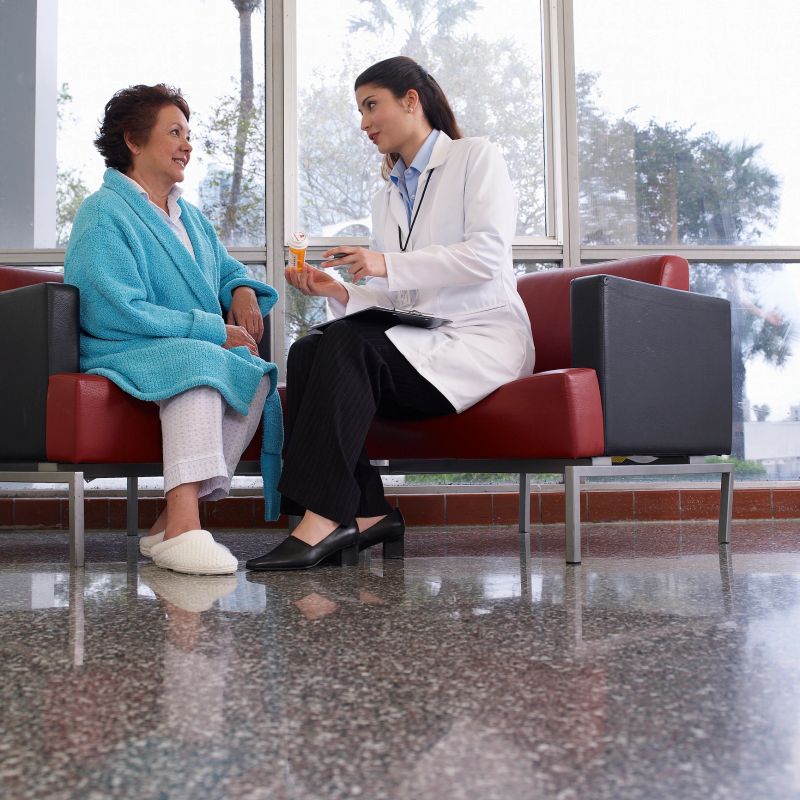 doctor discussing medication with patient