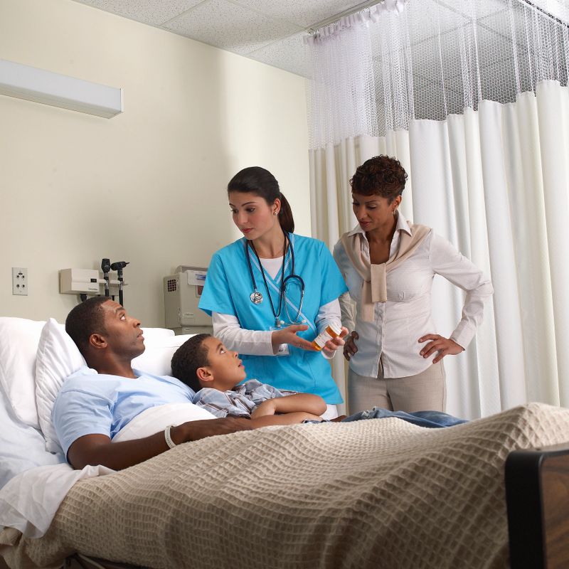 Nurse advisers patient of his medication with family present 